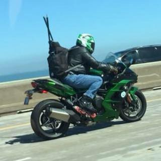 Inline skates used as a mobility aid riding a motorcycle